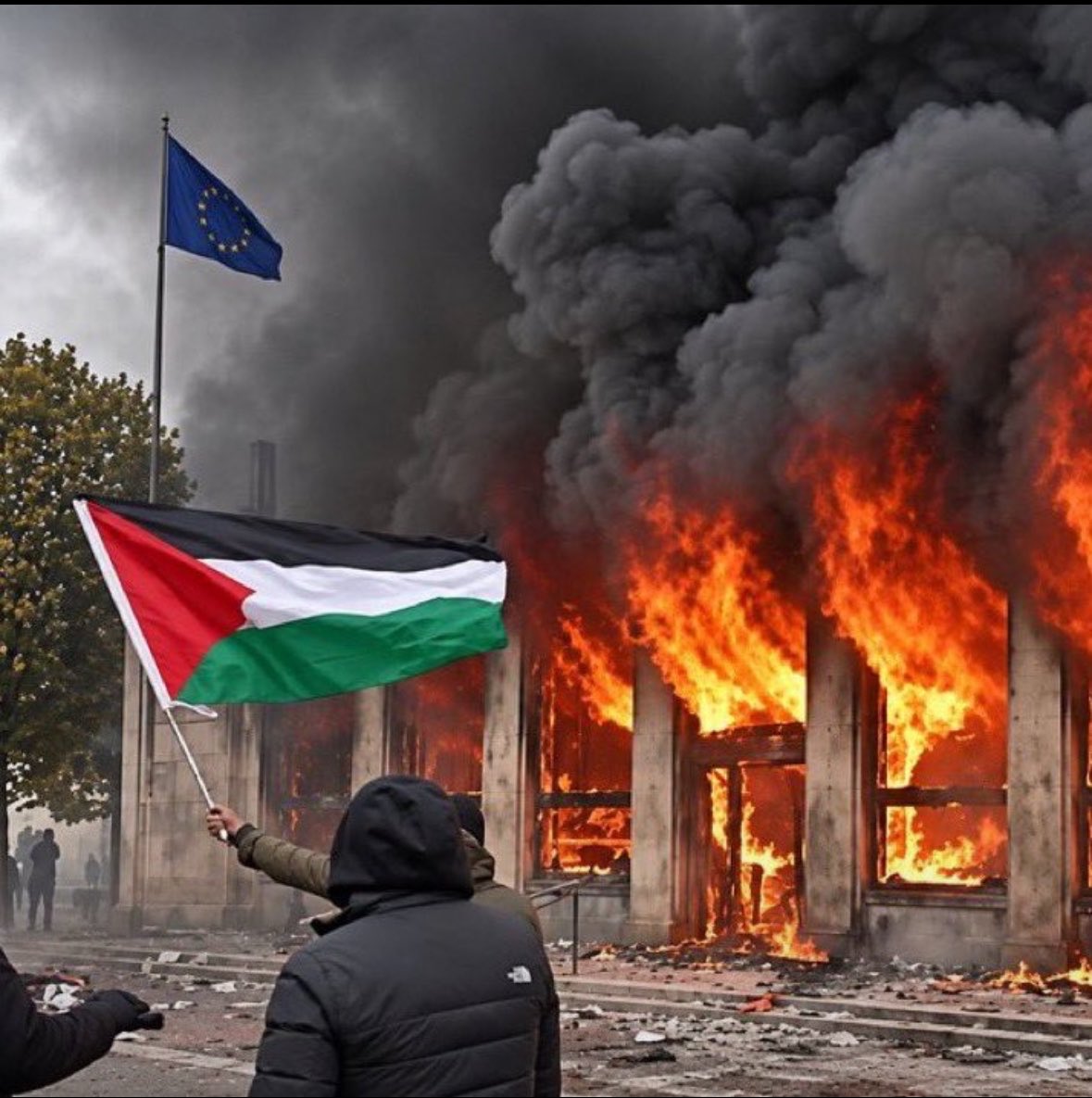 A protester waves a Palestinian flag in front of a burning building