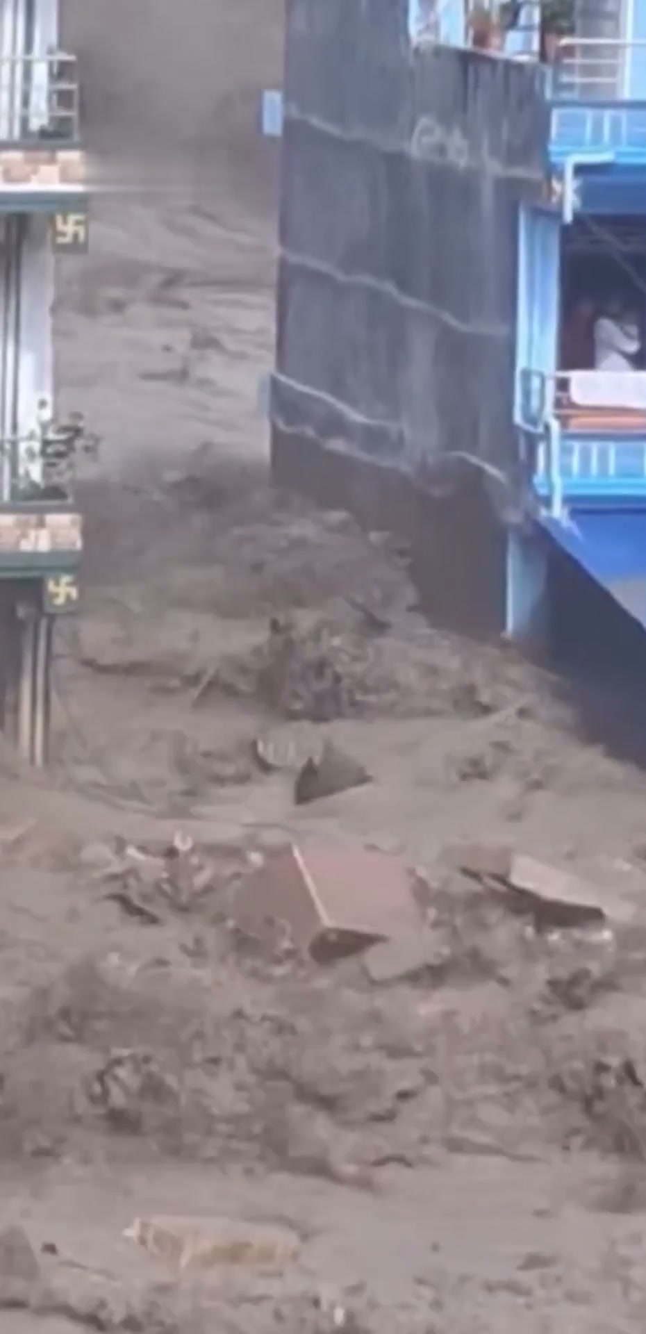 A building swept away by floodwaters in Nepal