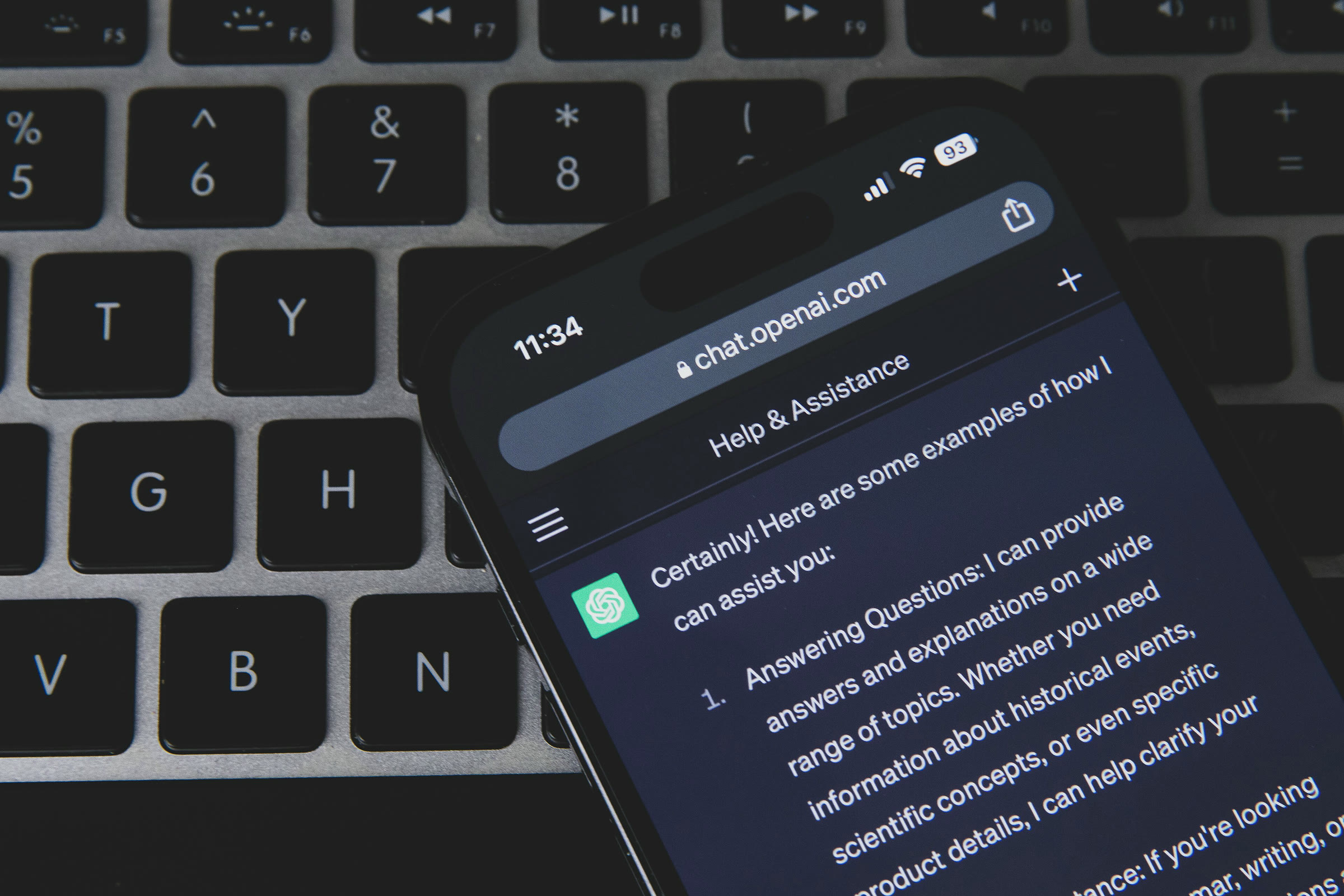 A smartphone showing ChatGPT on a keyboard