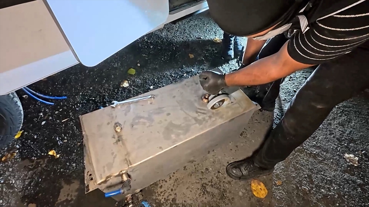 One of the tanks removed from under the camper